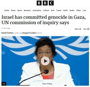 A person speaking into a microphone
Description automatically generated